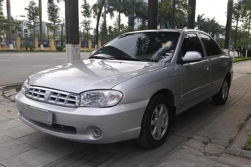 thay-kinh-chan-gio-xe-kia-spectra Thay Kính Chắn Gió Xe KIA Spectra